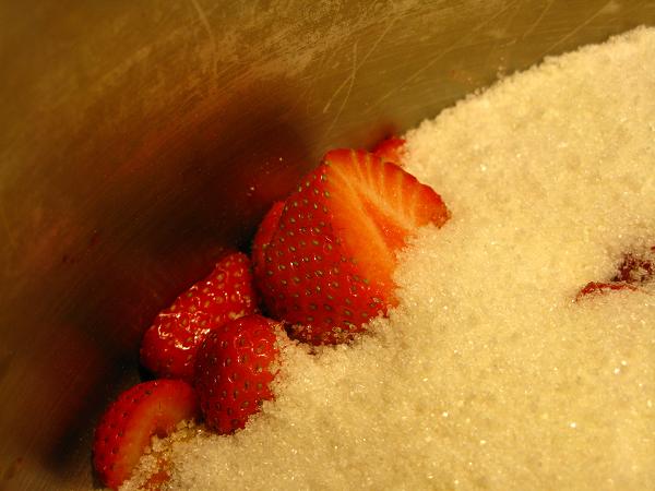 strawberries and sugar in pan