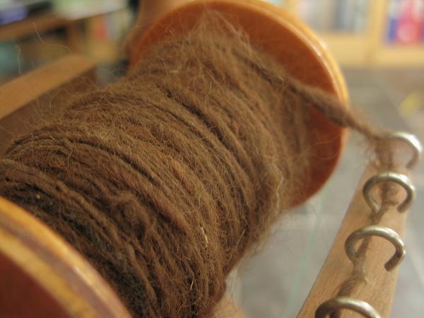spinning brown alpaca wool