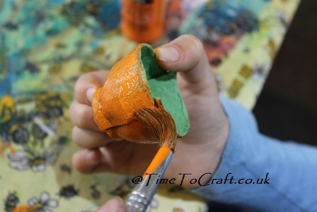 painting the egg carton pumpkin