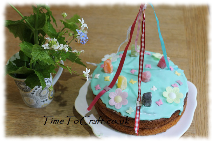 may day cake and wildflowers