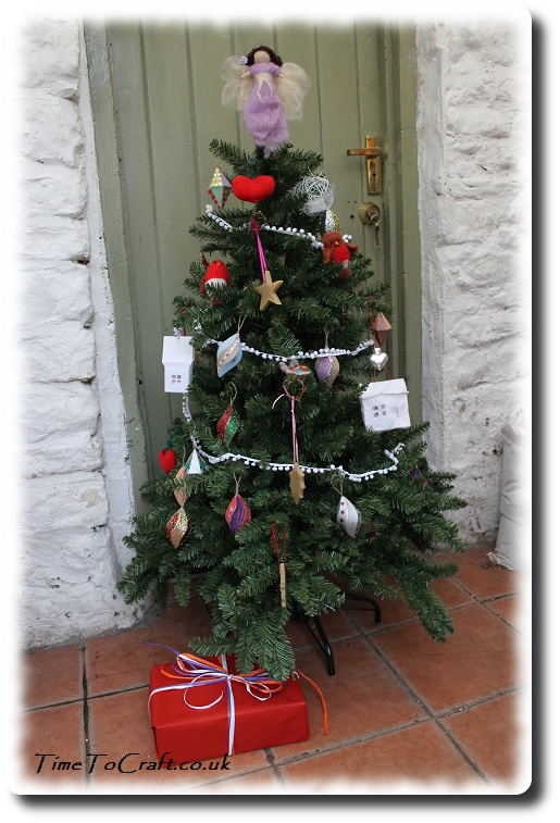 christmas tree against old door