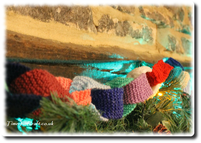 knitted paper chain above fireplace