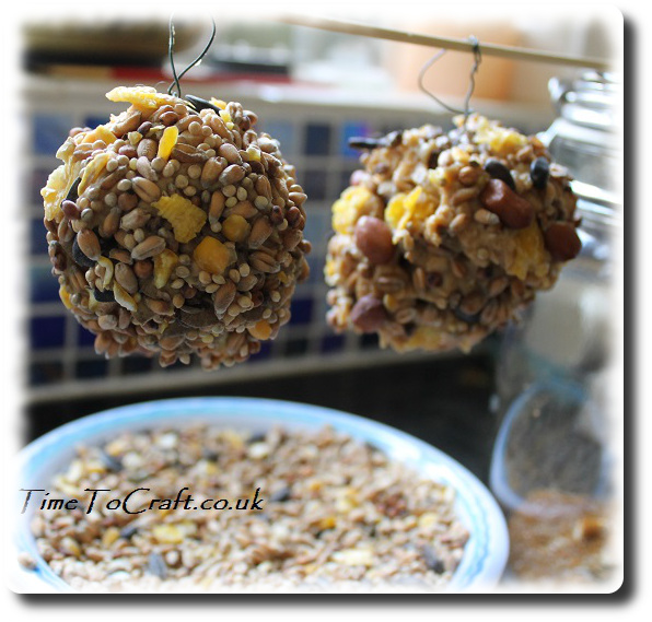 peanut and seed bird feeders using pine cone