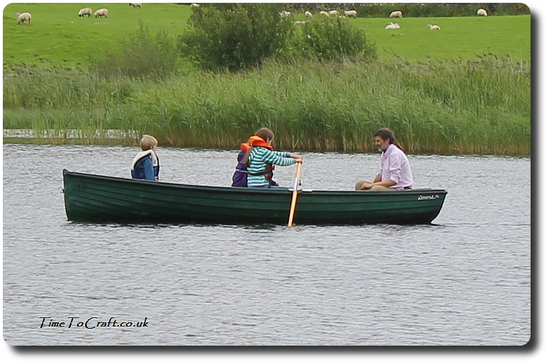girls rowing in lake District