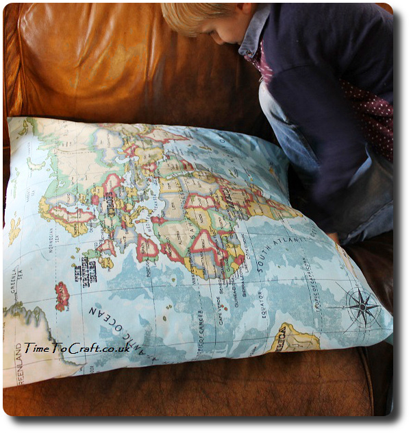 studying the world atlas cushion