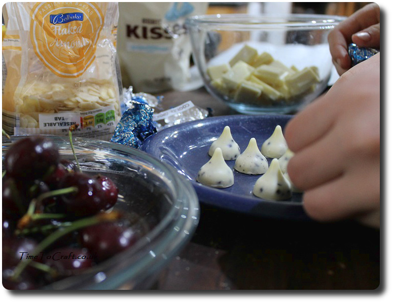 making Hershey Kiss mice with cherries and white chocolate