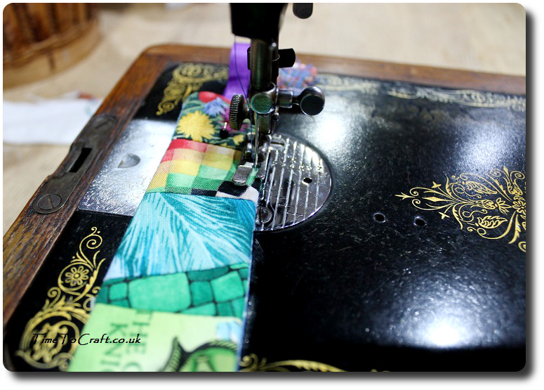 machine sewing the fabric bookmark