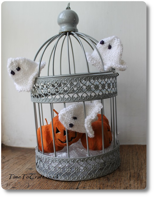 Knitted ghosts in cage