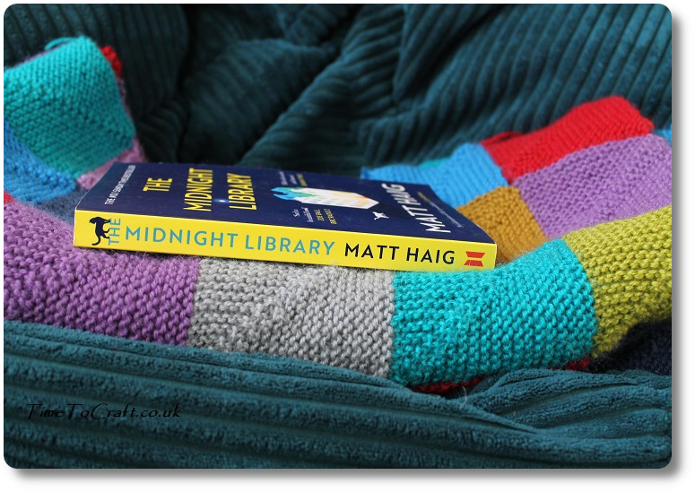 book on folded knitted blanket