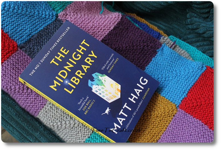The midnight Library on knitted blanket