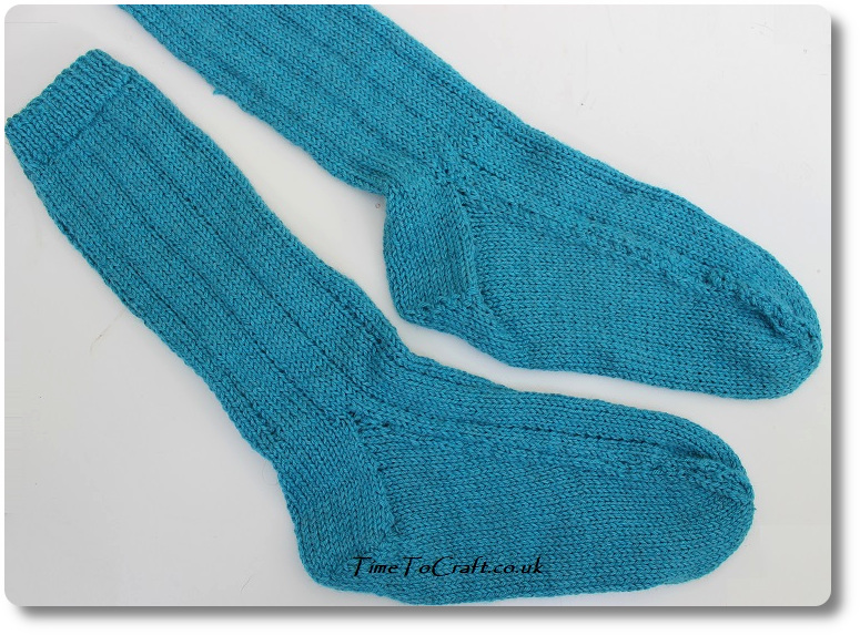blue socks in double knit on two needles